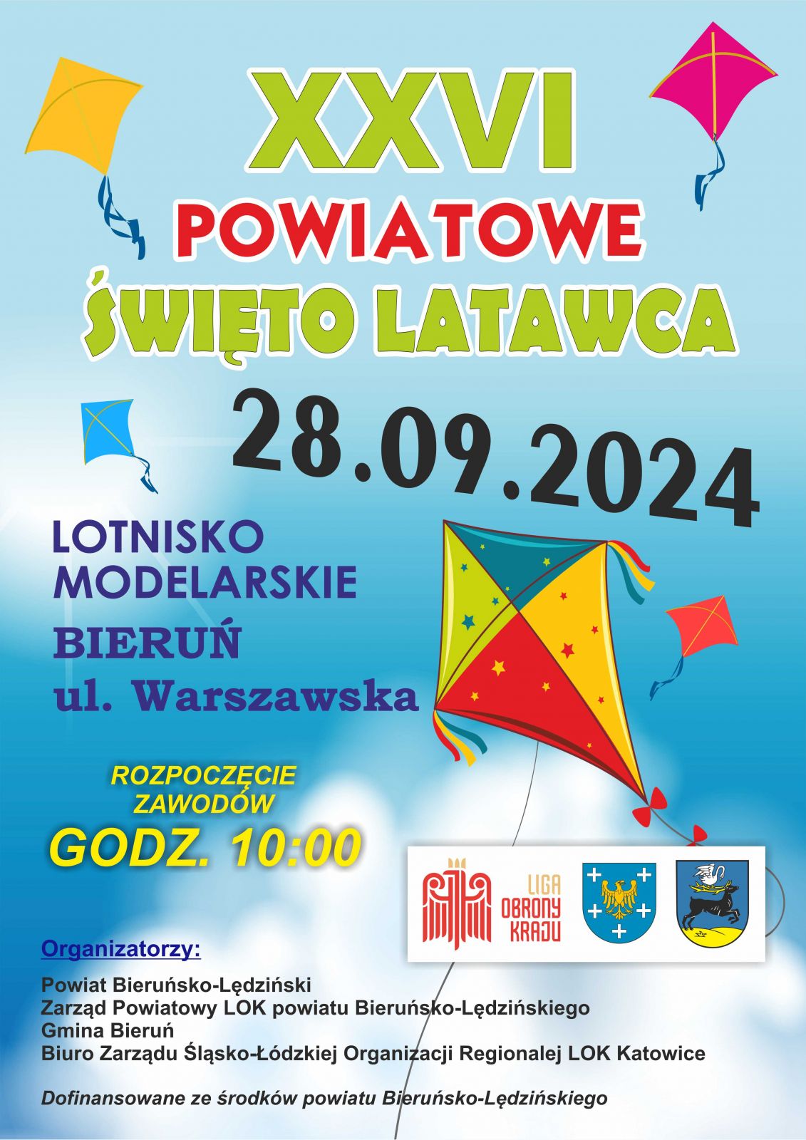 Plakat informacyjny w lolorze niebieskim, z grafiką kolorowego latawca 